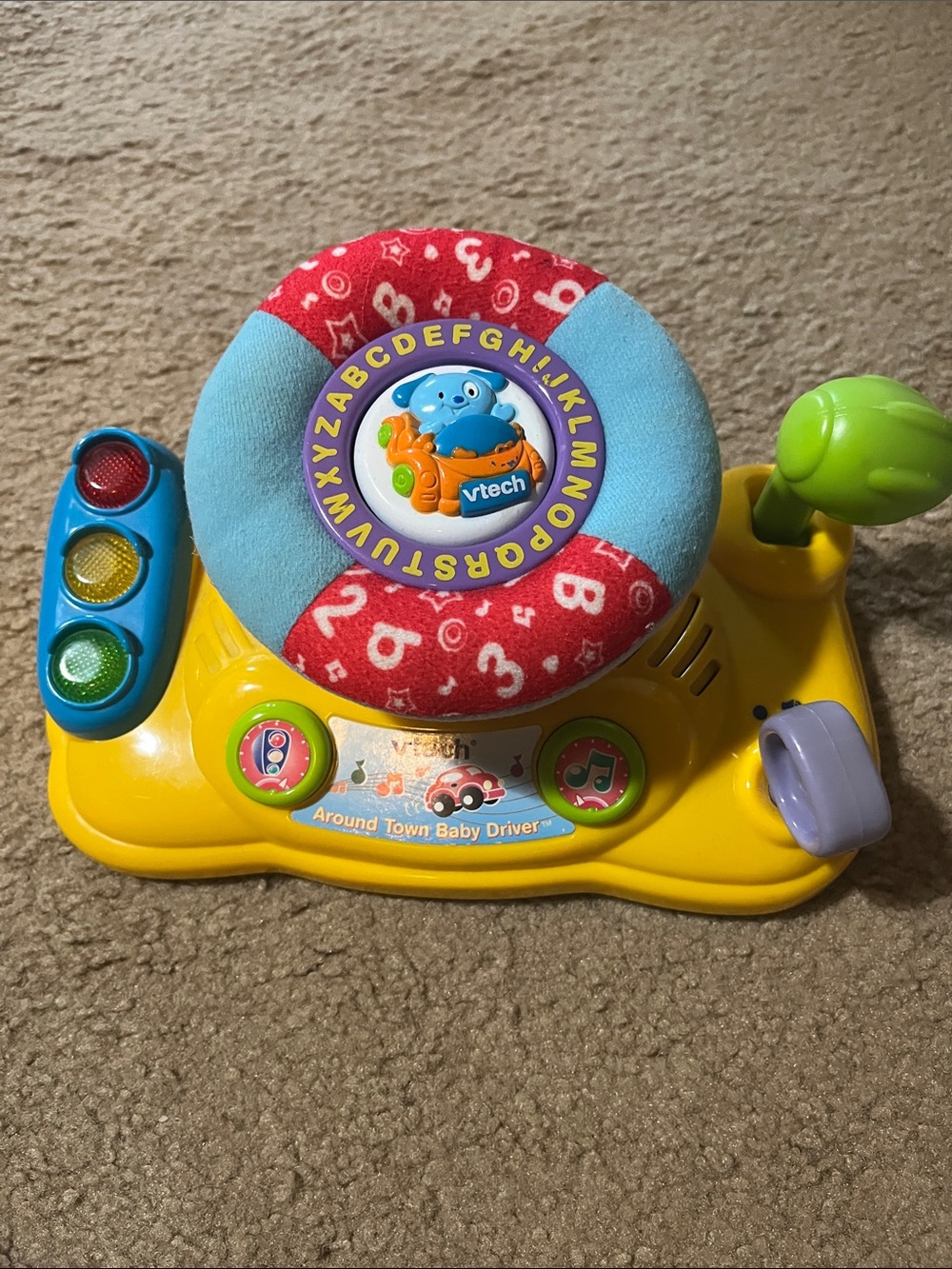 VTech Around Town Baby Driver Interactive Steering Toy - Yellow/Red/Blue/Green